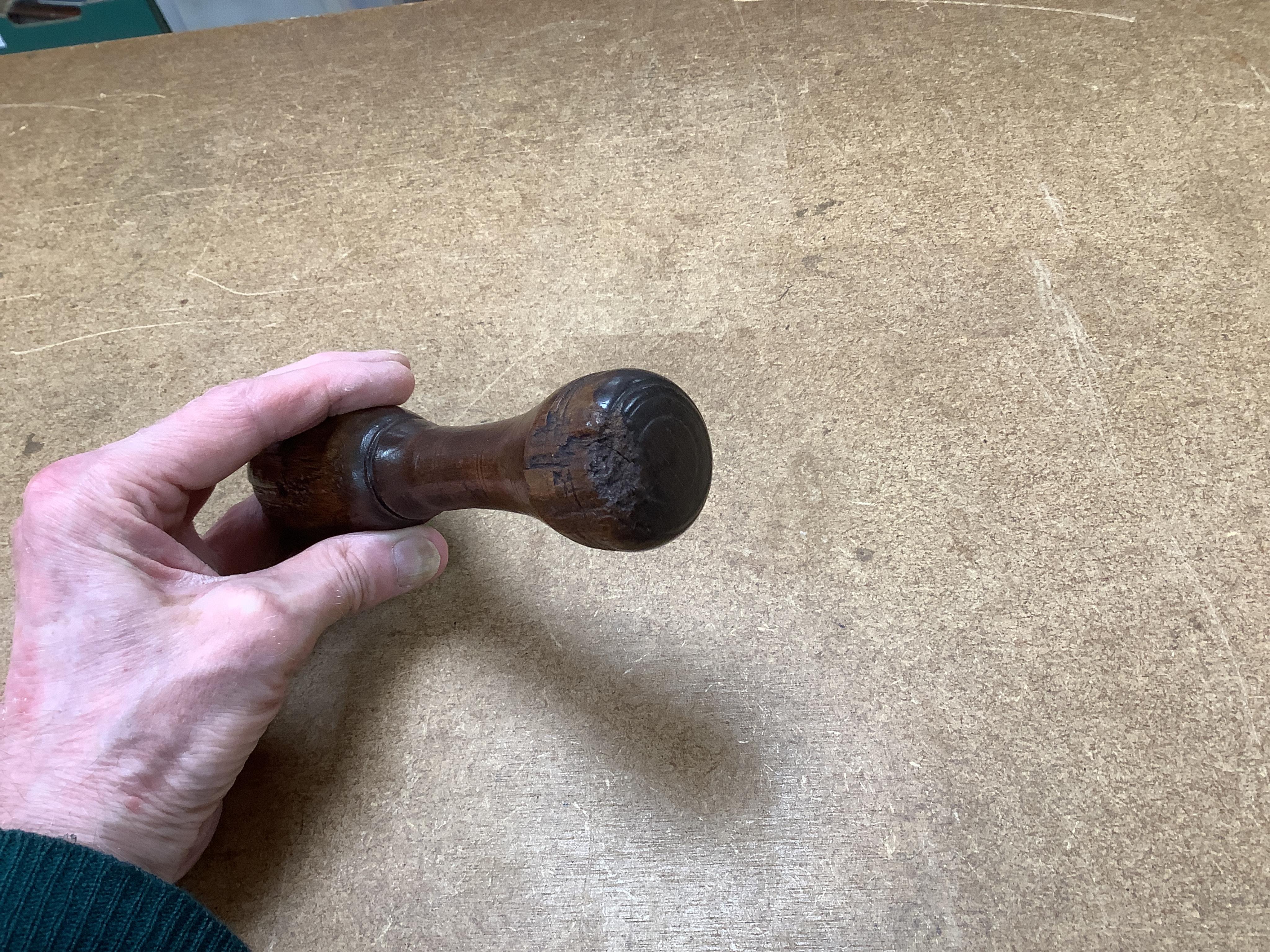 Sundry items to include a large pestle, spice grinder, flat iron on stand, bronze mortar and three other items, largest 42cm in length